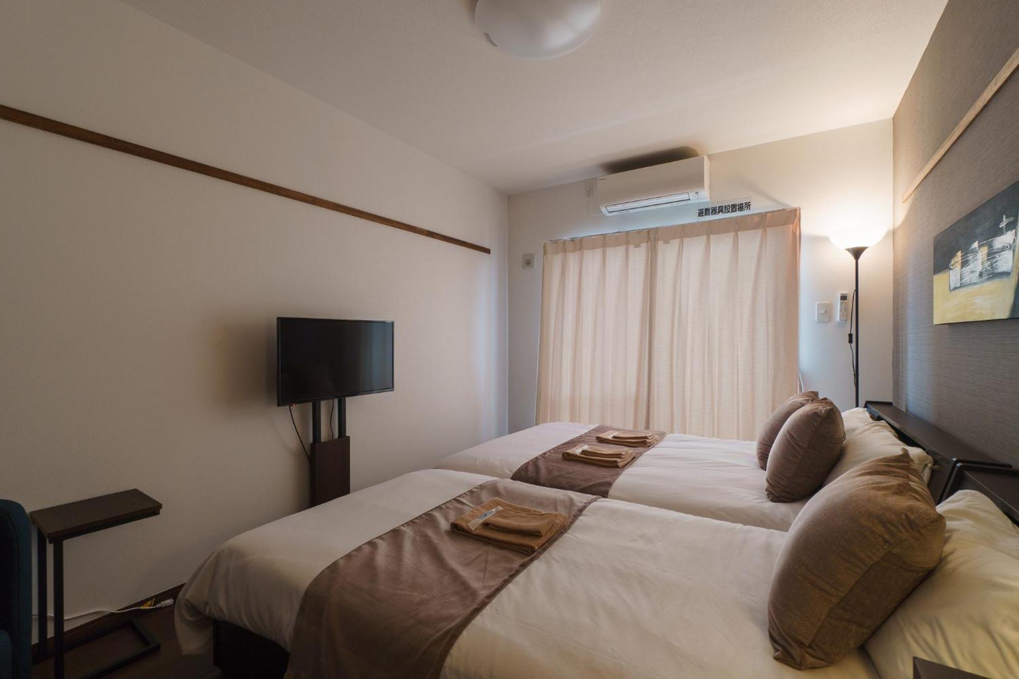 มิสเตอร์คินทาโระ Aparthotel นาฮะ ภายนอก รูปภาพ