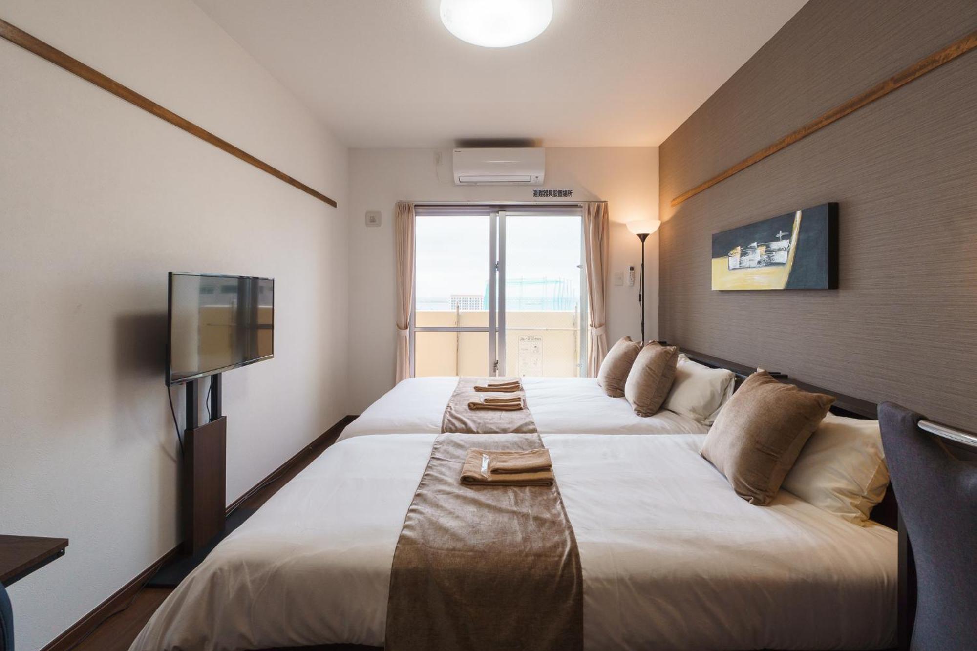 มิสเตอร์คินทาโระ Aparthotel นาฮะ ภายนอก รูปภาพ